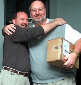 Columbia Tribune Sports Editor, Kent Heitholt, on right after being given a box of golf balls the night of October 31, 2001 by Managing Editor Jim Robertson in recognition of his five year tenure mark. This photo was taken only a few short hours before he was savagely beaten and murdered. Columbia Tribune photo.